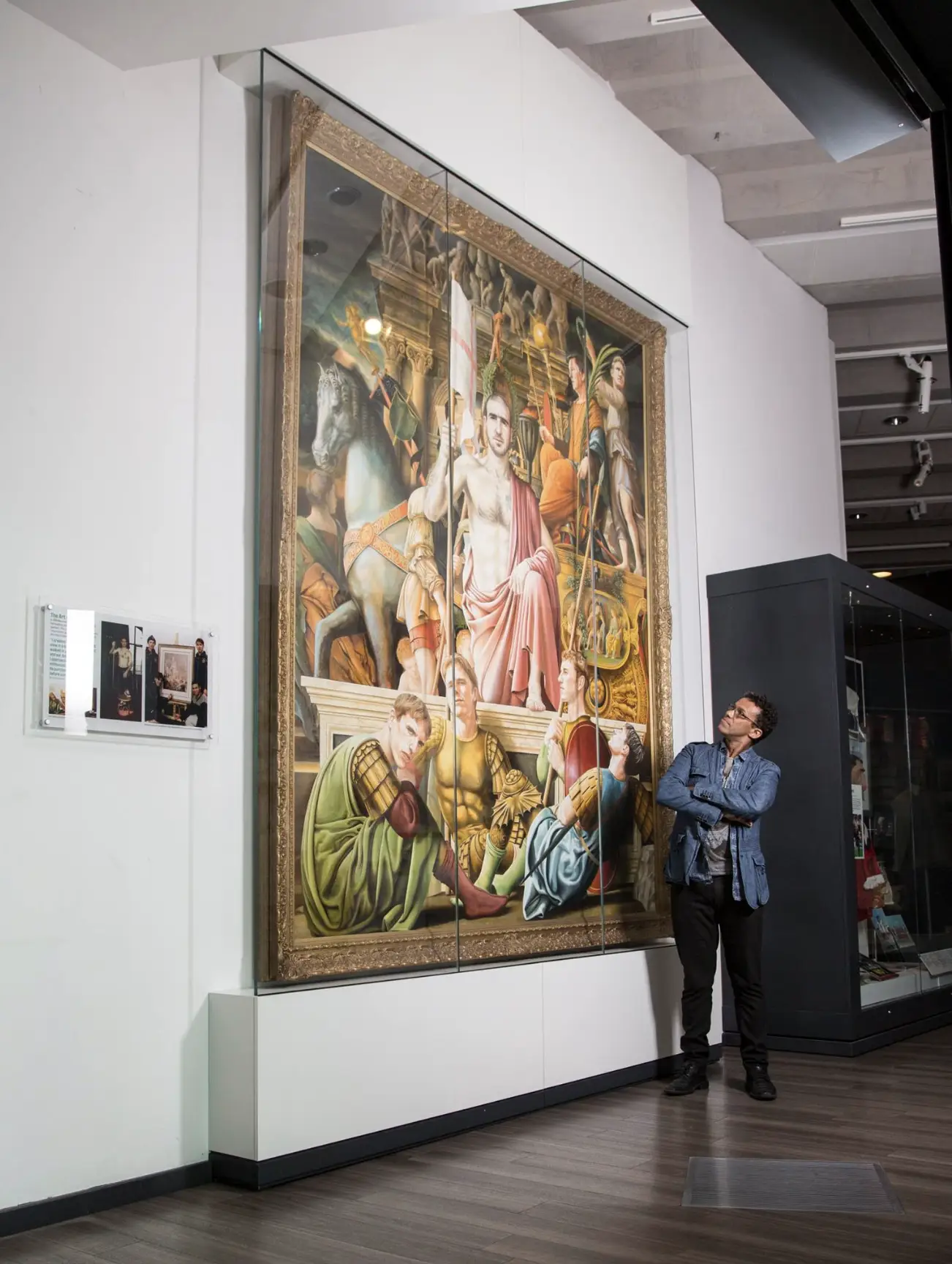 Viewer observing the massive scale of The Art of the Game.